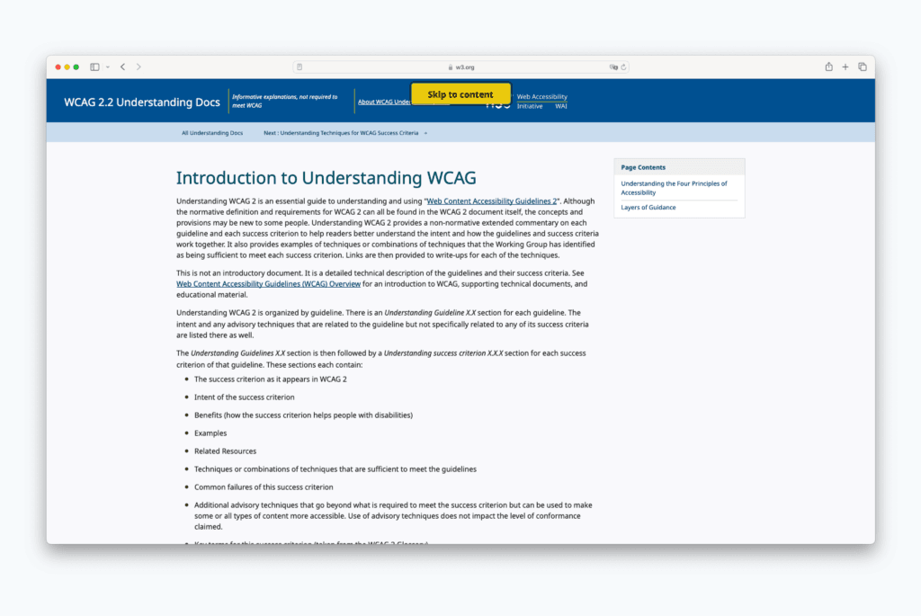 Ein Screenshot der Website von w3.org zeigt einen gelben “Zum Inhalt springen”-Button, der durch Drücken der “Tab”-Taste auf der Tastatur ausgelöst wird. Der Button ermöglicht Benutzern assistiver Technologien, direkt zum Inhaltsbereich zu springen.