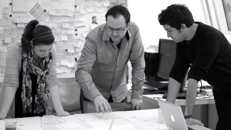 warroom huddle2.jpg dmcgroup